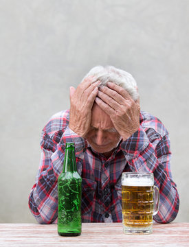 Senior drunk man with hangover