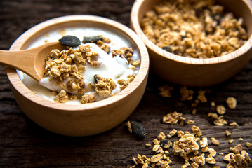 Yogurt with muesli for breakfast in the morning, loss weight and diet slimming for women, old wood background.  Diet and Healthy Concept.