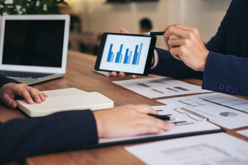 Co working conference, Business team meeting present, investor colleagues discussing new plan financial graph data on office table with laptop and calculator, Finance, accounting, investment
