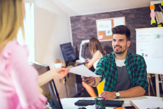 Woman Giving Her Application Portfolio To The Interviewer In A Job Interview