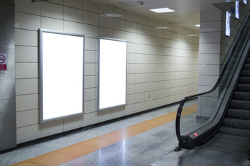 Blank billboard in subway station