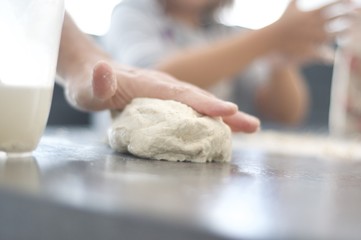 Kneading pizza
