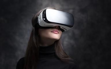 Young woman wearing virtual reality glasses