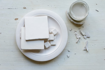 The workplace of ceramist. Blanks for painting. A creative workshop . Minimalistic composition in bright colors
