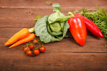 Fresh vegetables on a wooden texture. Proper nutrition. Vegetarianism. Space for text.