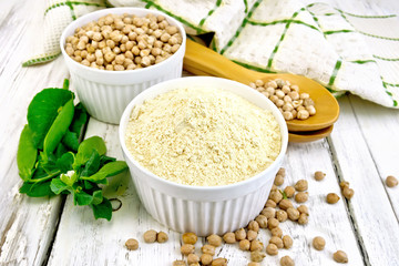 Flour chickpeas in white bowl on board