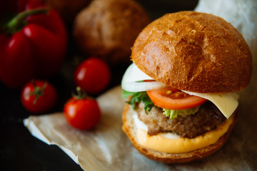 Delicious fresh homemade burger on a wooden table