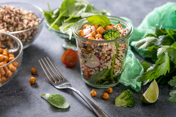 Quinoa salad with chickpeas, spinach, avocado and veggies, healthy vegan food, dieting, clean eating, vitamin and protein snack
