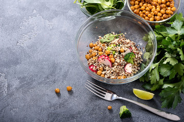 Quinoa salad with chickpeas, spinach, avocado and veggies, healthy vegan food, dieting, clean eating, vitamin and protein snack