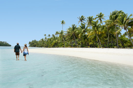 Couple Walk on Aitutaki Lagoon Cook Islands