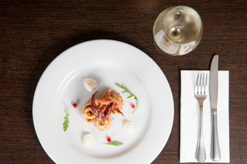 Calamari freshly prepared seafood on a white plate