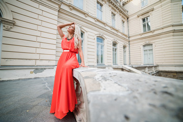 portrait of a beautiful blonde near castle