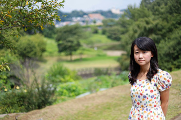 a portrait of beautiful woman in the park