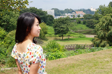 a portrait of beautiful woman in the park