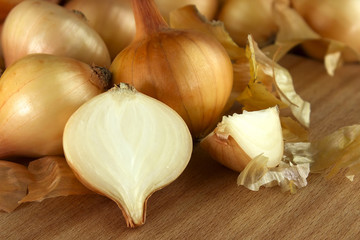 Onion on wooden background