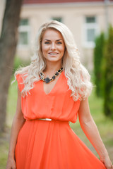 portrait of a beautiful blonde near castle