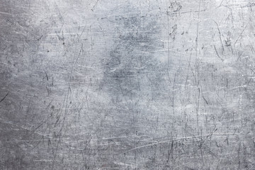 Old metal sheet background, brushed silver surface of iron