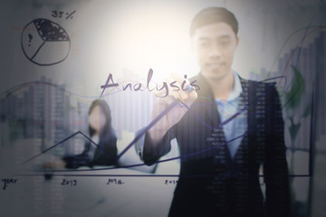 Businessman writing financial analysis graph with key performance indicators. - 171848724
