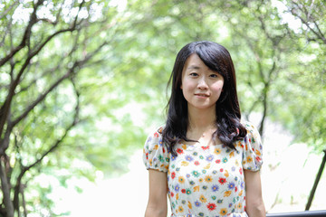 Fototapeta premium a portrait of beautiful woman in the park