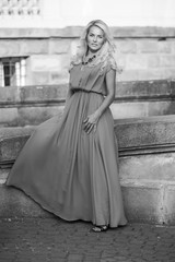 Naklejka premium portrait of a beautiful blonde near castle