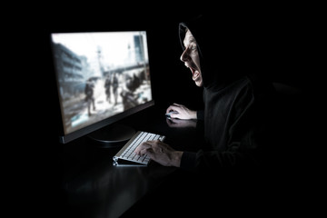 Young gamer in the dark