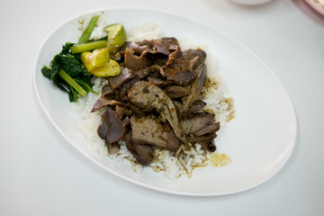 Stir fried pork liver on cooked rice
