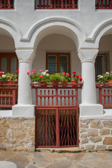 Fototapeta na wymiar Medieval wooden balcony with flowers
