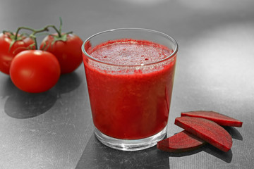 Glass of fresh vegetable smoothie on table