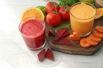 Fresh smoothies, vegetables and fruits on table