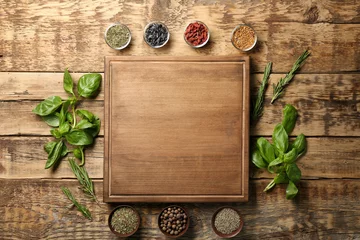 Crédence de cuisine en verre imprimé Herbes Composition with wooden board, spices and herbs on table