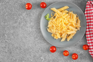 Tasty pasta with cheese on table. Cooking for one concept
