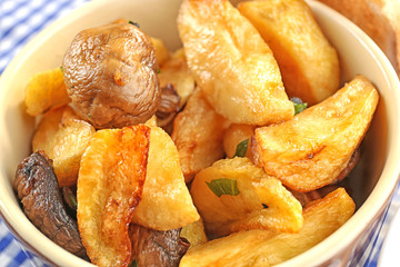 Baking dish with potatoes on table, closeup. Cooking for one concept