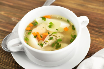Plate with tasty soup on table. Cooking for one concept