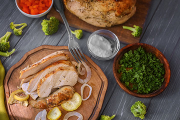 Composition with delicious turkey on wooden table