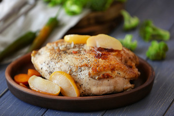 Tray with delicious turkey breast on wooden table