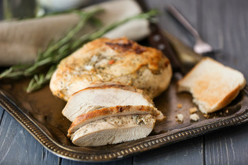 Delicious sliced turkey breast on metal tray
