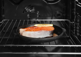 Salmon steak with lemon in oven