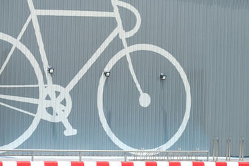 Fototapeta na wymiar Modern gray wall with white bike picture