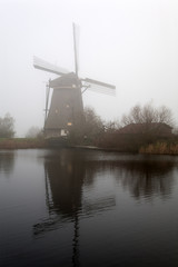 Windmill on foggy day, Unesco World Heritage Site, Kinderdijk, Netherlands