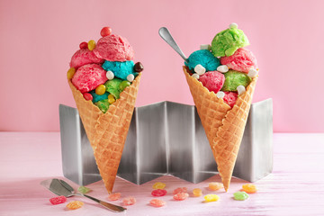 Composition with ice cream and candies on color background