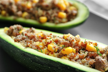 Quinoa stuffed zucchini on plate, closeup