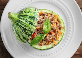 Quinoa stuffed zucchini on white plate