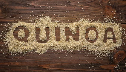 Foto op Canvas Word made from grains of quinoa on wooden table © Africa Studio