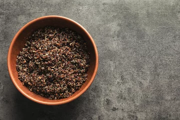 Plexiglas foto achterwand Bowl with boiled quinoa grains on kitchen table © Africa Studio
