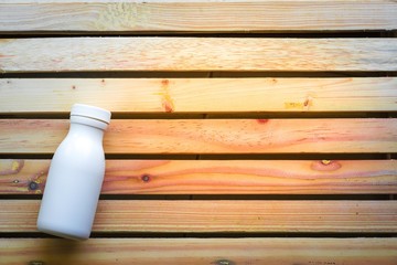 Bottle water made to plastic on the wood background.Using wallpaper for package or product, drug image and copy space.