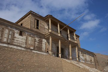 Historic wooden building from the era of nitrate mining in the Atacama Desert, in the coastal town of Pisagua in the Tarapaca Region of northern Chile.