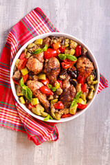 Baked drumsticks with vegetables