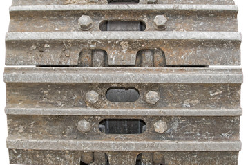 Details of rusted caterpillar tracks of a mobile crane