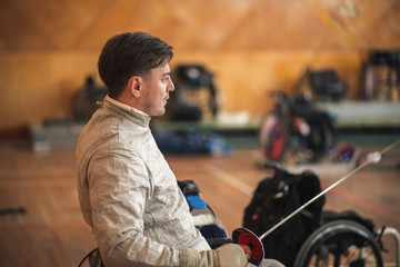 disabled fencers and their trainer at workout