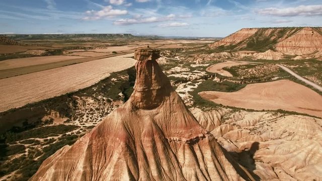 Epic drone footage of natural wonder of spain south desert, rock sand geological formations created by errosion, wind and earth powers, sunny summer day with mountains